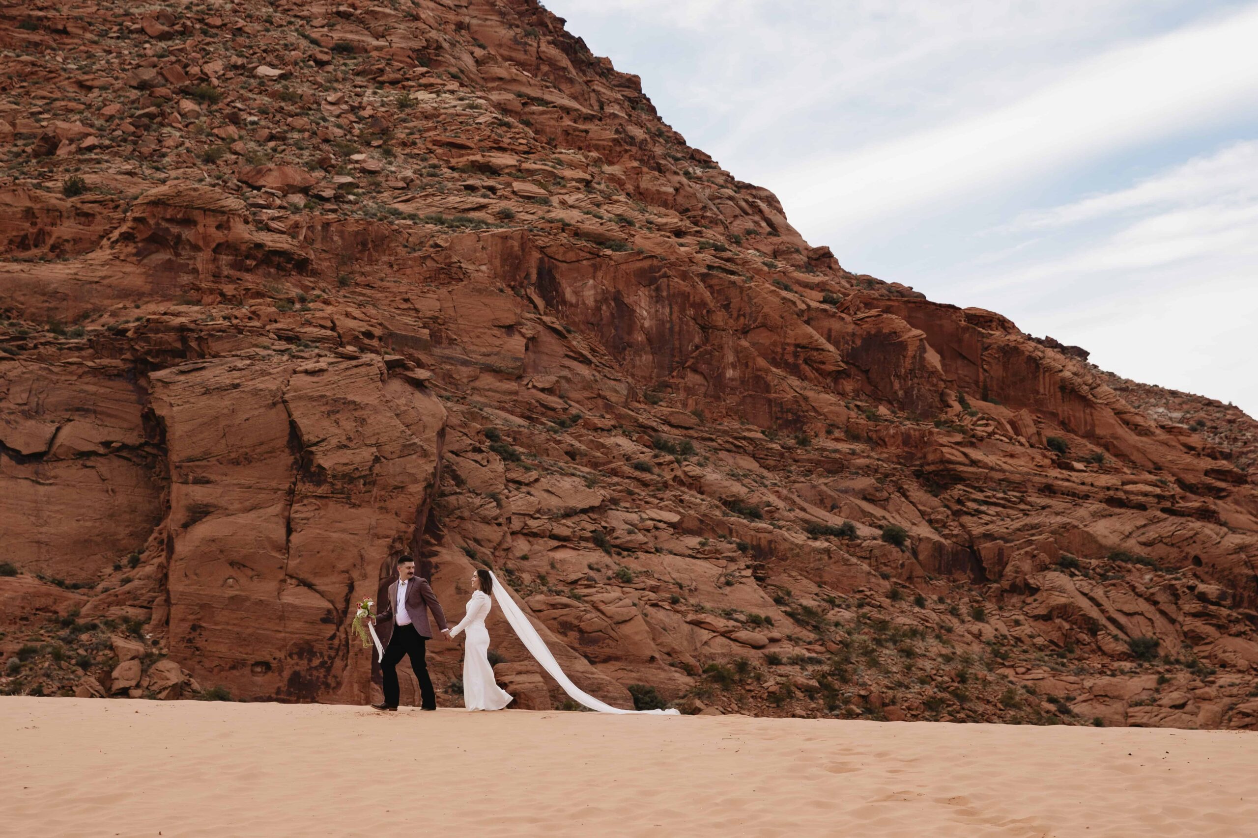 bride and groom in the sand dunes for their St. George elopement